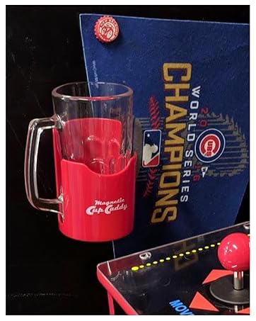 Image of magnetic drink caddy holding a tumbler mug next to arcade machine.