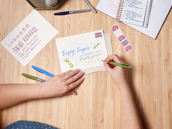 hand writing desk wood table letters invites colorful party flair paper mate stamps office school