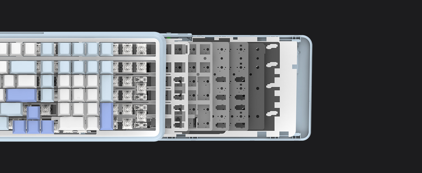 Overhead view of a mechanical keyboard with white, gray, and light blue keycaps. The keyboard has a full layout including a number pad and function keys.