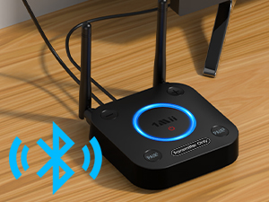 Black wireless router or hub device with blue LED ring light, sitting on wooden surface.