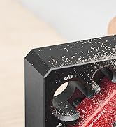 Close-up of a black electronic device interface with numerical markings and circular dial controls, showing water or dust resistance.