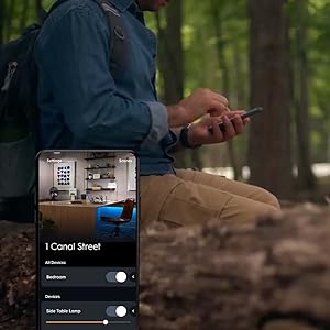 man controlling lights away from home through cync app