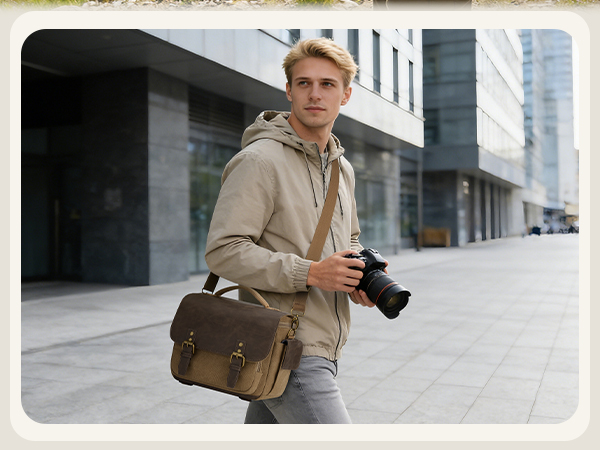 A modern urban setting with someone wearing a beige/tan jacket and brown messenger bag walking through a contemporary architectural space with glass and concrete elements.