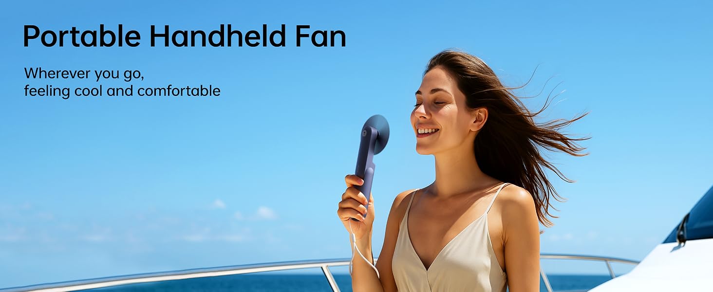 Text reads "Portable Handheld Fan" and "Whisper-quiet, go-on, hand-held portable". Woman outdoors holding blue handheld fan against bright sky.