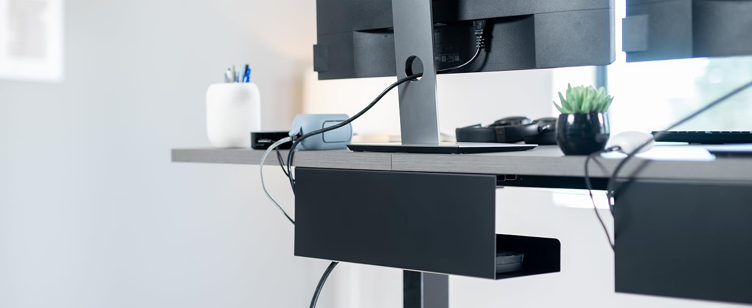 Sits just below the desktop to conceal cables while maintaining easy access when needed