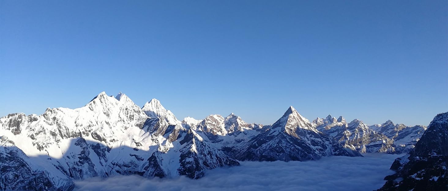 a view of the mountains from the top of a mountain.