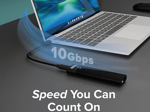 m.2 enclosure connected to laptop showing 10Gbps speed with “Speed You Can Count On” text
