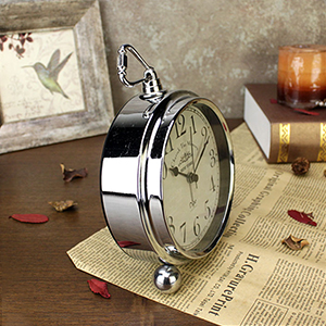 Silver alarm clock