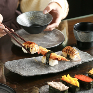 Sequence showing cooking process on dark surface, with ingredients being added and manipulated in stages.