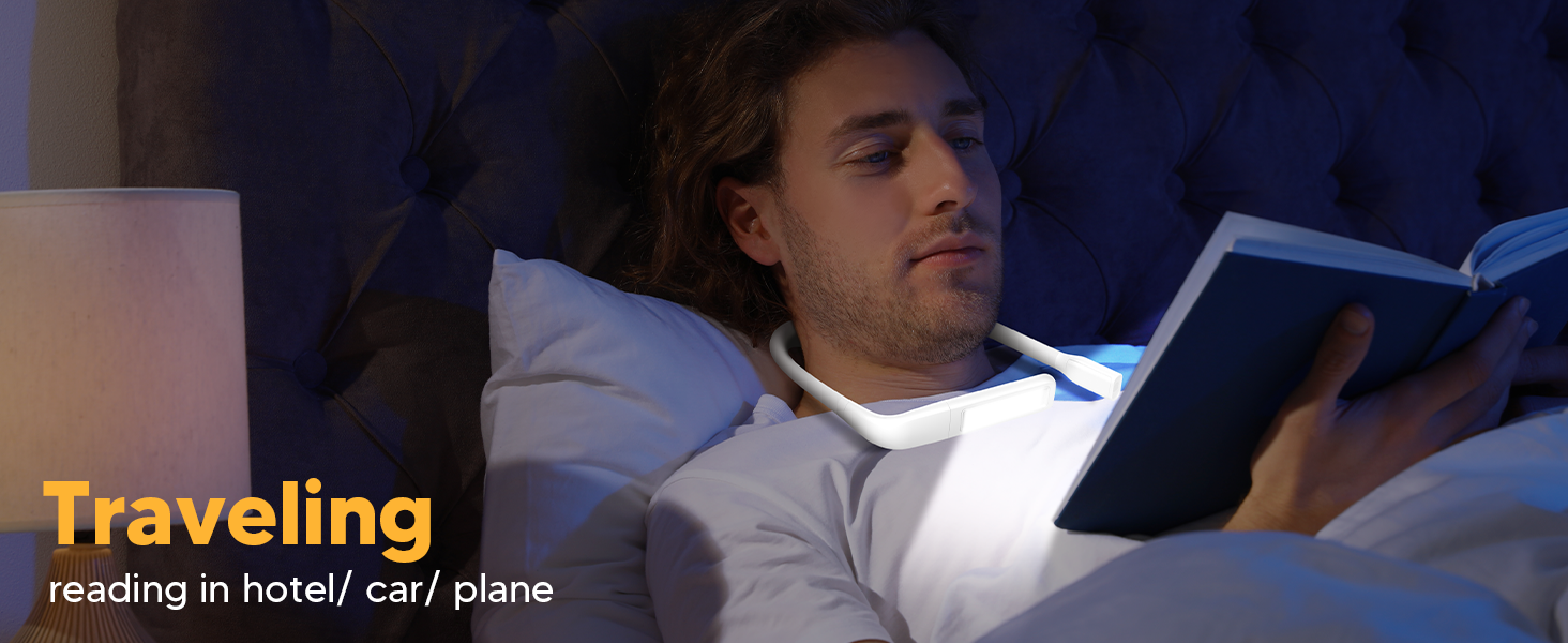 A young man is enjoying reading book in bed in the hotel room with the EastPin LED neck book light