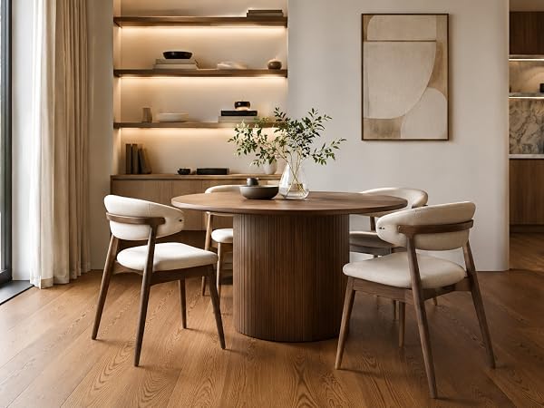 Elegant dining room featuring wooden floors and modern furniture