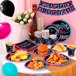 Colorful party supplies on pink background. Includes plates, cups, napkins, and 'Happy Birthday' banner. Space-themed designs with planets and stars.