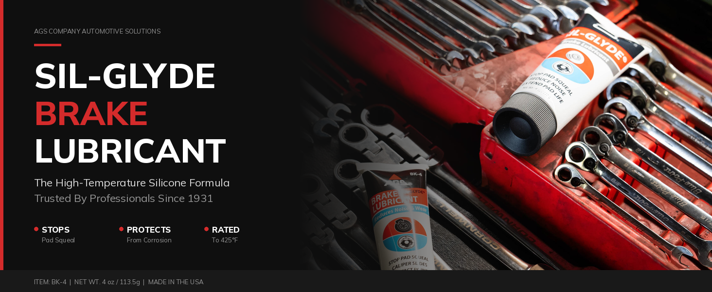 Sil-Glyde brake lubricant tube on a garage workbench with professional tools in the background