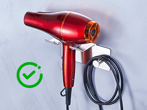 Sequence showing red hair dryer with checkmark symbol, demonstrating different positions or usage angles.