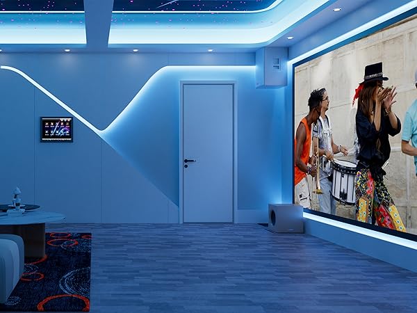 Modern room with blue LED lighting, wood-look flooring, and a large wall-mounted display showing a vibrant image. Small digital panel on left wall.