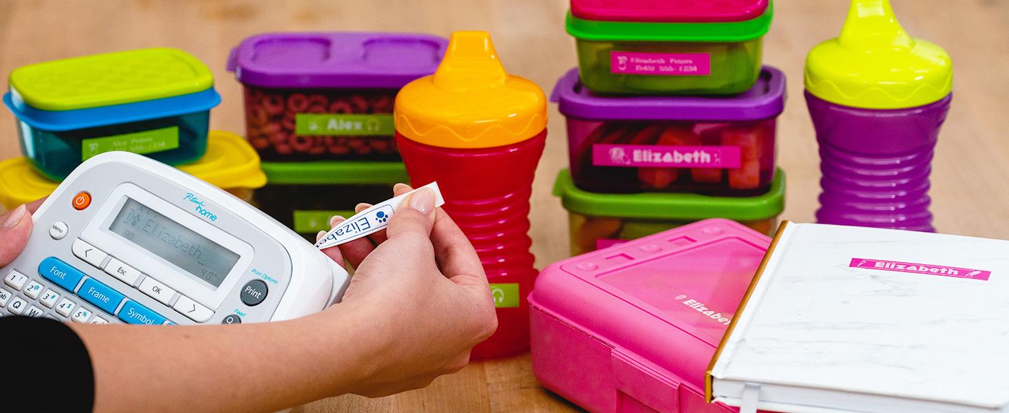 Various food storage containers and children's sippy cups with name labels