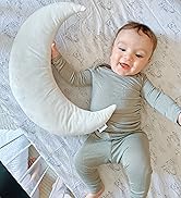 baby boy with a moon pillow