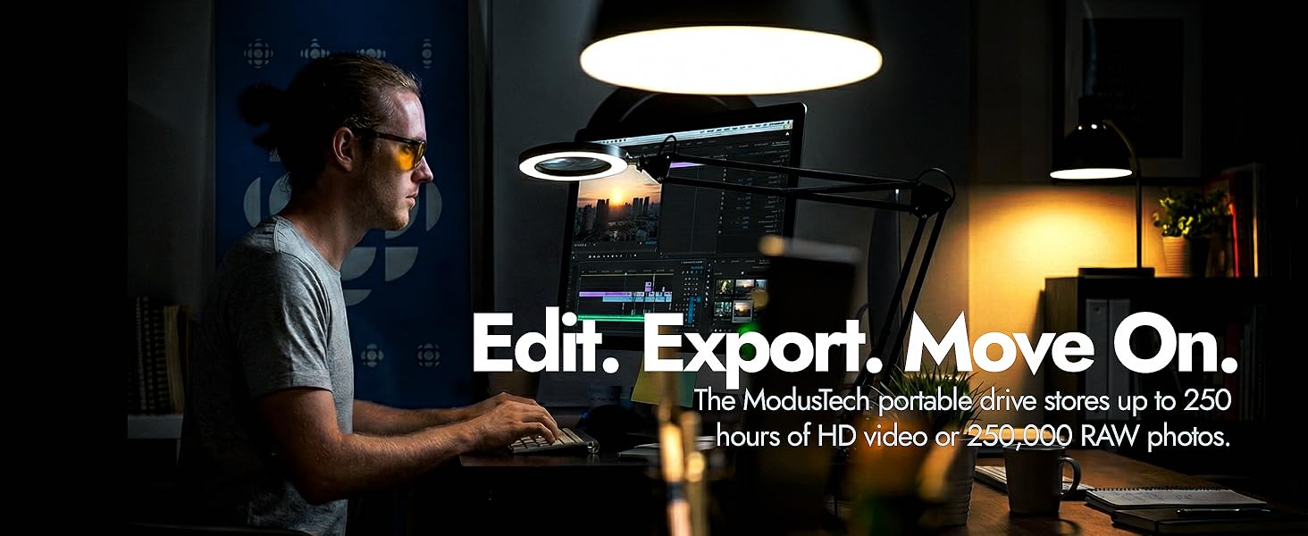 Video editor at desk using video editing software with ModusTech Facet drive for 4K video storage