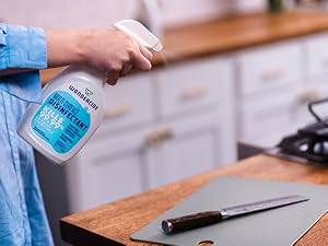 Spraying bottle of Wondercide Multi-Surface Disinfectant Spray