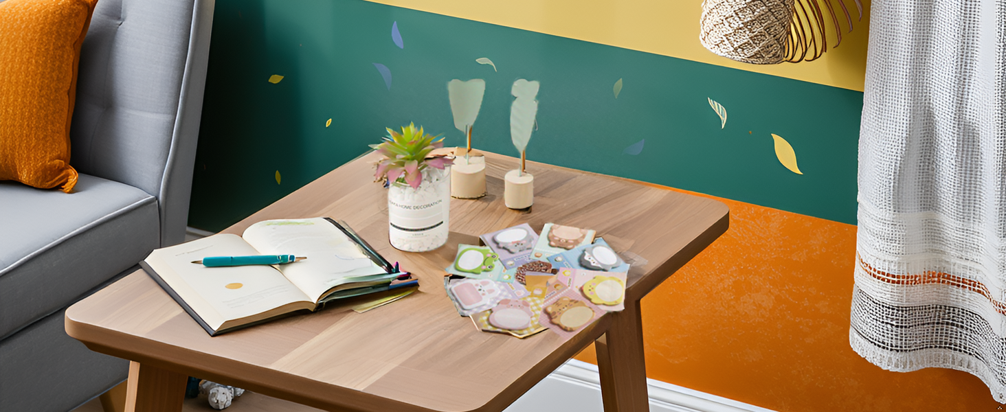 A wooden desk with the product and office supplies scattered around.
