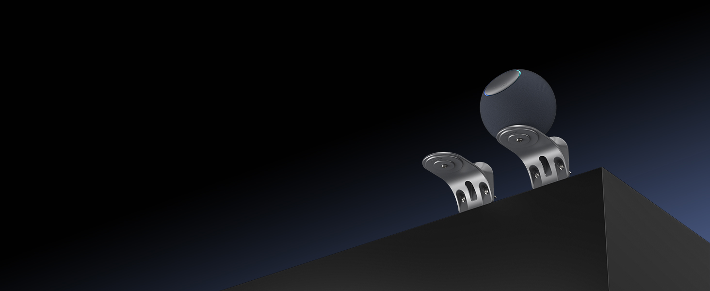 Dark promotional image showing electronic device or accessory with metallic elements against black background. Limited visibility of complete product details.