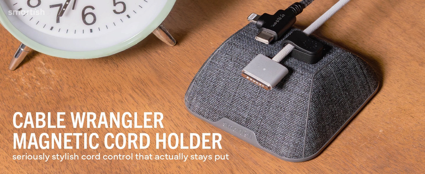 Cable Wrangler magnetic cord holder on wood desk holding USB-C and Lightning cables within reach