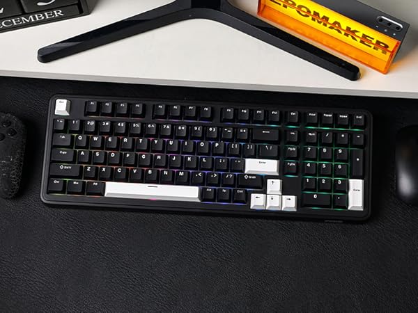 a keyboard and mouse sitting on a desk.