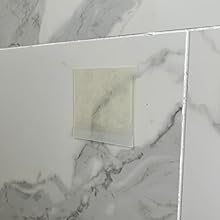 HairStixies installed on a shower wall
