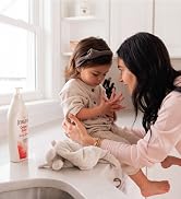 Bottle of Jergens Original Scent Lotion on counter next to a child with her mother.