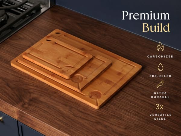 Pre-oiled, carbonized 3pc cutting board set on kitchen countertop.