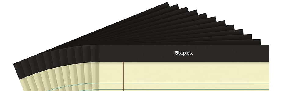 A wooden desk with the product neatly stacked on top, surrounded by office supplies like pens and pa