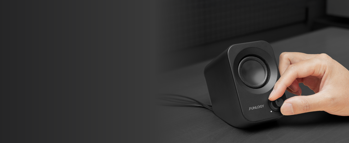 FUNLOGY Speaker Plus front volume dial being adjusted by hand.