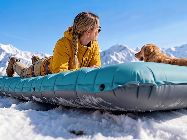 Airlive2000 pad in snow with user and dog; full air support from head to toe.