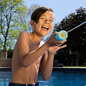 Happy kid shooting Max Liquidator Water Blaster on Pool Side