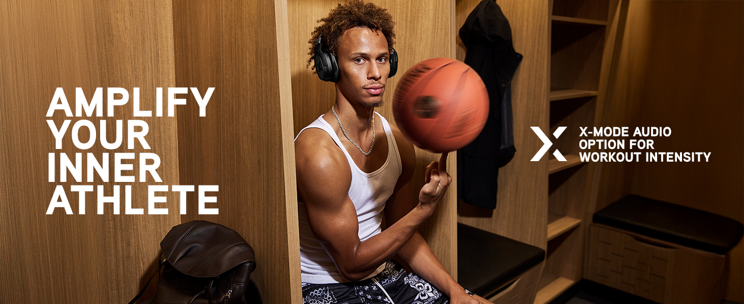 Dyson sits in locker room spinning a basketball on his finger while wearing black Pump X headphones