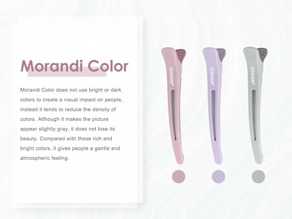 Three markers or pens in muted pastel colors - pink, lavender, and gray - displayed with matching color dots below each, demonstrating Morandi color palette concept.