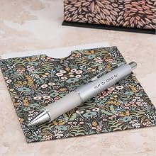 Photo shows Dr. Grip Limited pen resting on a greeting card