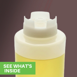 A plastic squeeze sauce bottle with an inverted lid is filled with olive oil.