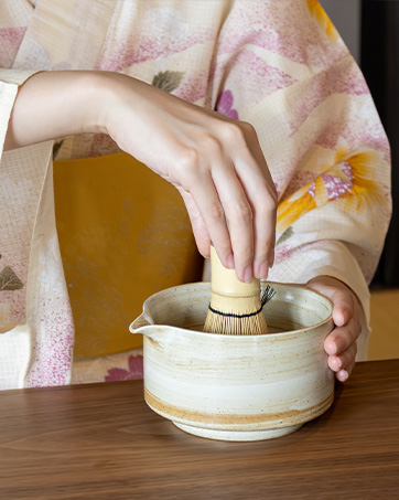 whisking matcha