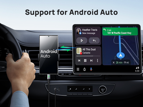 Car dashboard display showing Android Auto interface. Navigation map, music controls, and message notification visible on screen.