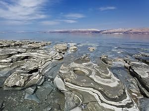 black mud on the shore of the Dead Sea