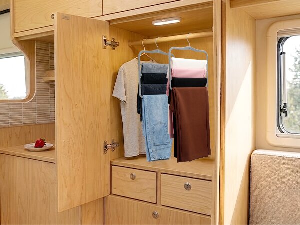 pants hangers organizing jeans in compact RV camper closet for travel living essentials