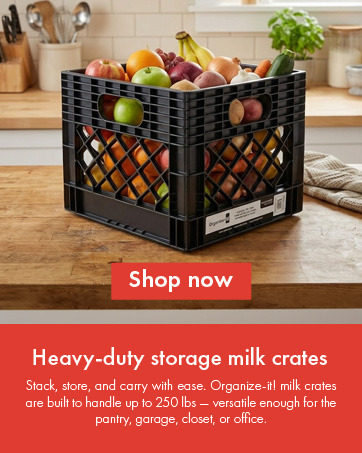 Black milk crate filled with fruits and vegetables on kitchen counter