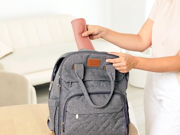 Prep silicone placemat rolled inside diaper bag for convenient travel and on-the-go baby meals