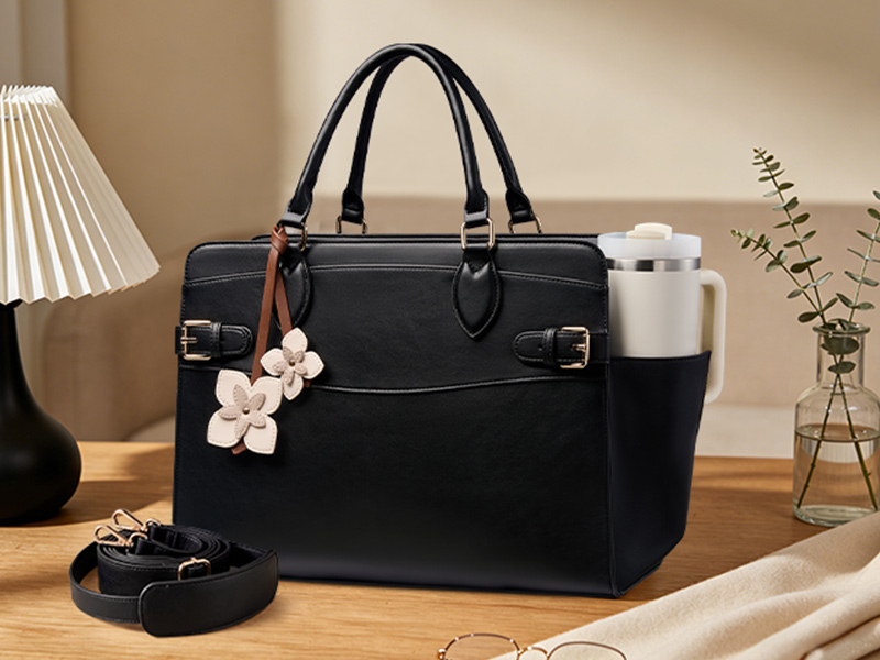 Side cup holder keeps your tumbler within reach. Adjustable strap for shoulder or crossbody wear.