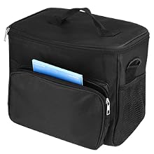 Black insulated lunch bag with front zippered pocket and side mesh pocket. Compact cube shape with carrying handle on top.
