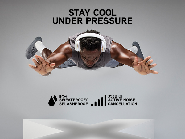 Athlete suspended in mid-air wearing white Pump X headphones above a large white X-shaped platform