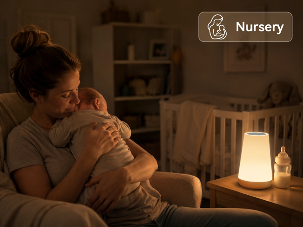 Portable warm night light on bedside table, sleeping baby in nursery room for night feeding