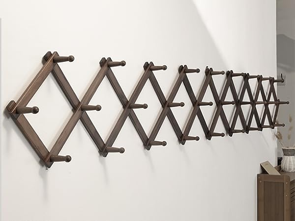 Vintage color diamond shaped wooden hanger with 28 hooks on the wall