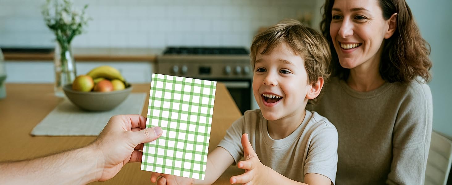 Kid celebrates birthday with friends and blank note cards and envelopes.